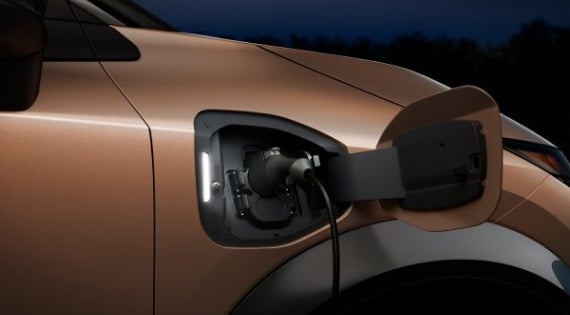 Close-up image of charging cable plugged in | Cronic Nissan in Griffin GA